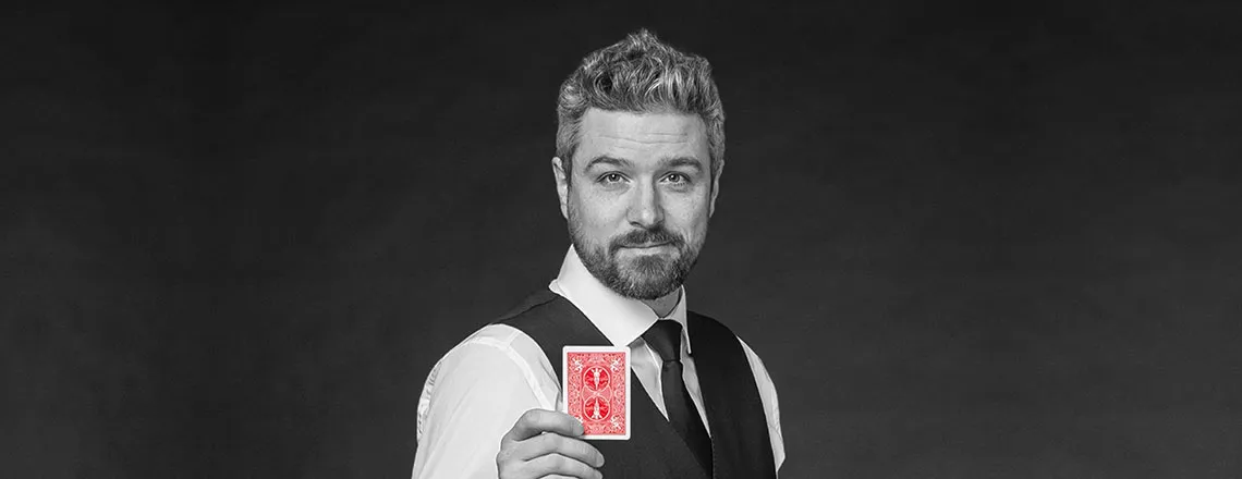 Magician Andre Desery with a card